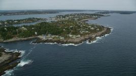 6k aerial stock footage flying by coastal town, Bailey Island, autumn, Harpswell, Maine Aerial Stock Footage | AX147_379