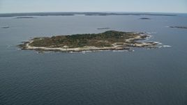 6K aerial stock footage approaching an isolated house, Ragged Island, autumn, Harpswell, Maine Aerial Stock Footage | AX147_380E
