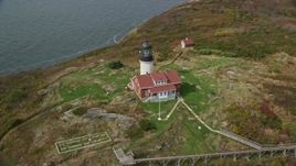 6K aerial stock footage approaching  Seguin Island, tilting up to reveal Seguin Light, Phippsburg, Maine Aerial Stock Footage | AX147_388E