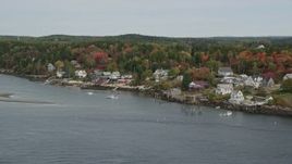 6K aerial stock footage flying over waterfront homes, colorful trees in autumn, Georgetown, Maine Aerial Stock Footage | AX147_398