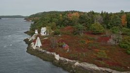 6K aerial stock footage flying by Perkins Island Light, Perkins Island, autumn, Georgetown, Maine Aerial Stock Footage | AX147_401