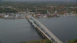 6K aerial stock footage flying by Sagadohoc Bridge, small town, autumn, Bath, Maine Aerial Stock Footage | AX147_413