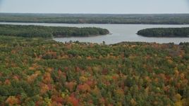 6K aerial stock footage flying by Montsweag Bay, colorful forest, autumn, Woolwich, Maine Aerial Stock Footage | AX147_419