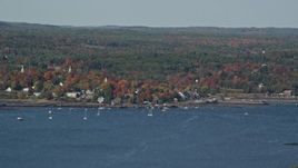 6K aerial stock footage flying by a small waterfront town, autumn, Wiscasset, Maine Aerial Stock Footage | AX148_002