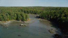 6k aerial stock footage flying over Damariscotta River, forest, isolated homes, autumn, Damariscotta, Maine Aerial Stock Footage | AX148_016