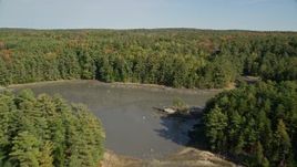 6K aerial stock footage flying over Damariscotta River, forest, isolated homes, autumn, Damariscotta, Maine Aerial Stock Footage | AX148_016E