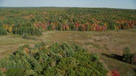 6k aerial stock footage approaching, flying over a colorful forest, autumn, Damariscotta, Maine Aerial Stock Footage | AX148_018