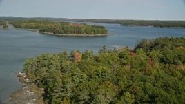 6K aerial stock footage approaching forested islands, The Narrows, autumn, Waldoboro, Maine Aerial Stock Footage | AX148_029