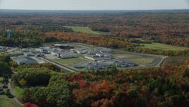 6k aerial stock footage orbiting Maine State Prison, colorful forest, autumn, Warren, Maine Aerial Stock Footage | AX148_064