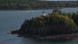 6K aerial stock footage orbiting Owls Head Light, fall foliage, autumn, Owls Head, Maine Aerial Stock Footage | AX148_083E