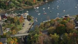 6K aerial stock footage orbiting small coastal town, Rockport Harbor, autumn, Rockport, Maine Aerial Stock Footage | AX148_096E
