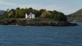 6k aerial stock footage approaching Curtis Island Light, reveal small coastal town, autumn, Camden, Maine Aerial Stock Footage | AX148_109