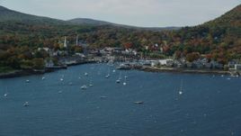 6k aerial stock footage approaching Camden Harbor, small coastal town, autumn, Camden, Maine Aerial Stock Footage | AX148_110