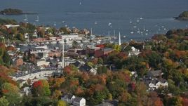 6K aerial stock footage orbiting small coastal town, Camden Harbor, autumn, Camden, Maine Aerial Stock Footage | AX148_114E