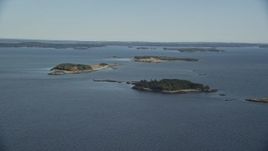 6K aerial stock footage approaching small islands, Hog Island, Maine Aerial Stock Footage | AX148_129E
