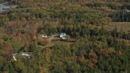 6K aerial stock footage approaching island homes, colorful trees in autumn, Little Deer Isle, Maine Aerial Stock Footage | AX148_137