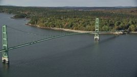 6K aerial stock footage orbiting the Deer Isle Bridge in autumn, Deer Isle Bridge, Maine Aerial Stock Footage | AX148_139E