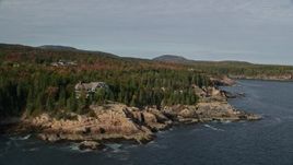 5.5K aerial stock footage flying by waterfront mansions, autumn, Seal Harbor, Mount Desert Island, Maine Aerial Stock Footage | AX148_170E