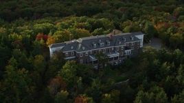 5.5K aerial stock footage flying by an isolated mansion, pan right, autumn, Bar Harbor, Maine Aerial Stock Footage | AX148_187