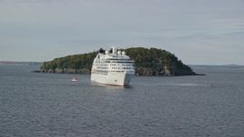 5.5K aerial stock footage flying by a cruise ship, tiny island, Bar Harbor, Maine Aerial Stock Footage | AX148_194