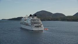 5.5K aerial stock footage tracking a cruise ship set against a tiny island, Bar Harbor, Maine Aerial Stock Footage | AX148_200