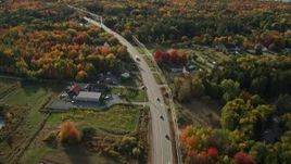 5.5K aerial stock footage of a bird's eye of road among forest with fall foliage, Bar Harbor, Maine Aerial Stock Footage | AX148_232E