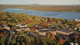 5.5K aerial stock footage orbiting the Maine Maritime Academy among fall foliage, autumn, Castine, Maine Aerial Stock Footage | AX149_073E