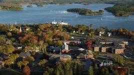 5.5K aerial stock footage orbiting Maine Maritime Academy among a coastal town, autumn, Castine, Maine Aerial Stock Footage | AX149_075