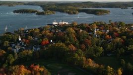 5.5K aerial stock footage orbiting a small coastal town and training ship, autumn, Castine, Maine Aerial Stock Footage | AX149_076E