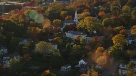 5.5K aerial stock footage orbiting homes and a white church among fall foliage, autumn, Castine, Maine Aerial Stock Footage | AX149_078E