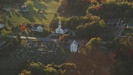 5.5K aerial stock footage flying by small church and cemetery, autumn, Stockton Springs, Maine Aerial Stock Footage | AX149_092