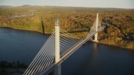 5.5K aerial stock footage flying by the Penobscot Narrows Bridge, autumn, Stockton Springs,  Maine Aerial Stock Footage | AX149_100E