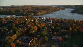 5.5K aerial stock footage orbiting a small coastal town on the Penobscot River, autumn, Bucksport, Maine Aerial Stock Footage | AX149_105E