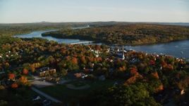5.5K aerial stock footage flying away from small coastal town, Penobscot River, autumn, Bucksport, Maine Aerial Stock Footage | AX149_107