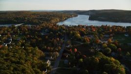 5.5K aerial stock footage approaching Penobscot Narrows Bridge from over small town, autumn, Bucksport, Maine Aerial Stock Footage | AX149_111
