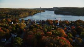 5.5K aerial stock footage flying over small town, approaching a bridge, autumn, Bucksport, Maine Aerial Stock Footage | AX149_112