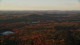 5.5K aerial stock footage of forest of colorful trees in autumn, Belfast, Maine, sunset Aerial Stock Footage | AX149_162