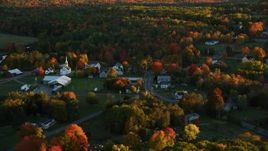5.5K aerial stock footage flying by small rural town, colorful forest in autumn, Searsmont, Maine, sunset Aerial Stock Footage | AX149_176