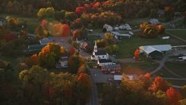 5.5K aerial stock footage orbiting small rural town, church, autumn, Searsmont, Maine, sunset Aerial Stock Footage | AX149_181