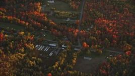 5.5K aerial stock footage flying by rural homes, Woodmans Mill Road, autumn, Liberty, Maine, sunset Aerial Stock Footage | AX149_188