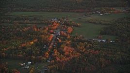 5.5K aerial stock footage flying by rural homes near Ridge Road, autumn, Windsor, Maine, sunset Aerial Stock Footage | AX149_207E