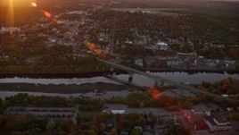 5.5K aerial stock footage approaching downtown, small bridge, Kennebec River, autumn, Augusta, Maine, sunset Aerial Stock Footage | AX149_214