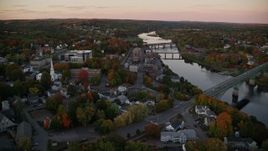 5.5K aerial stock footage flying by downtown, small bridges, Kennebec River, autumn, Augusta, Maine, twilight Aerial Stock Footage | AX149_220E