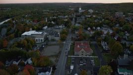 5.5K aerial stock footage flying over downtown in autumn, approach Lithgow Public Library, Augusta, Maine, twilight Aerial Stock Footage | AX149_224