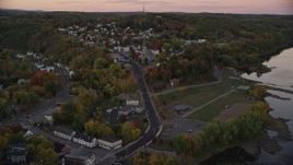 5.5K aerial stock footage flying over Northern Avenue, approach Saint Augustine Catholic Church, autumn, Augusta, Maine, twilight Aerial Stock Footage | AX149_236E