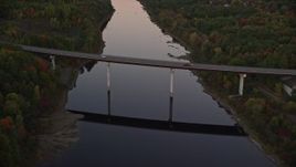 5.5K aerial stock footage approaching small bridge spanning Kennebec River, autumn, Augusta, Maine, twilight Aerial Stock Footage | AX149_239E