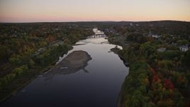 5.5K aerial stock footage flying over colorful forest, approach Kennebec River, autumn, Augusta, Maine, twilight Aerial Stock Footage | AX149_243E