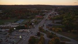 5.5K aerial stock footage of a Western Avenue strip mall in autumn, Augusta, Maine, twilight Aerial Stock Footage | AX149_254E
