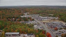 5.5K aerial stock footage flying by car dealerships, Western Avenue, autumn, Augusta, Maine Aerial Stock Footage | AX150_001