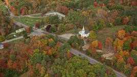 5.5K aerial stock footage flying by East Winthrop Baptist Church, Western Avenue, autumn, Winthrop, Maine Aerial Stock Footage | AX150_008E